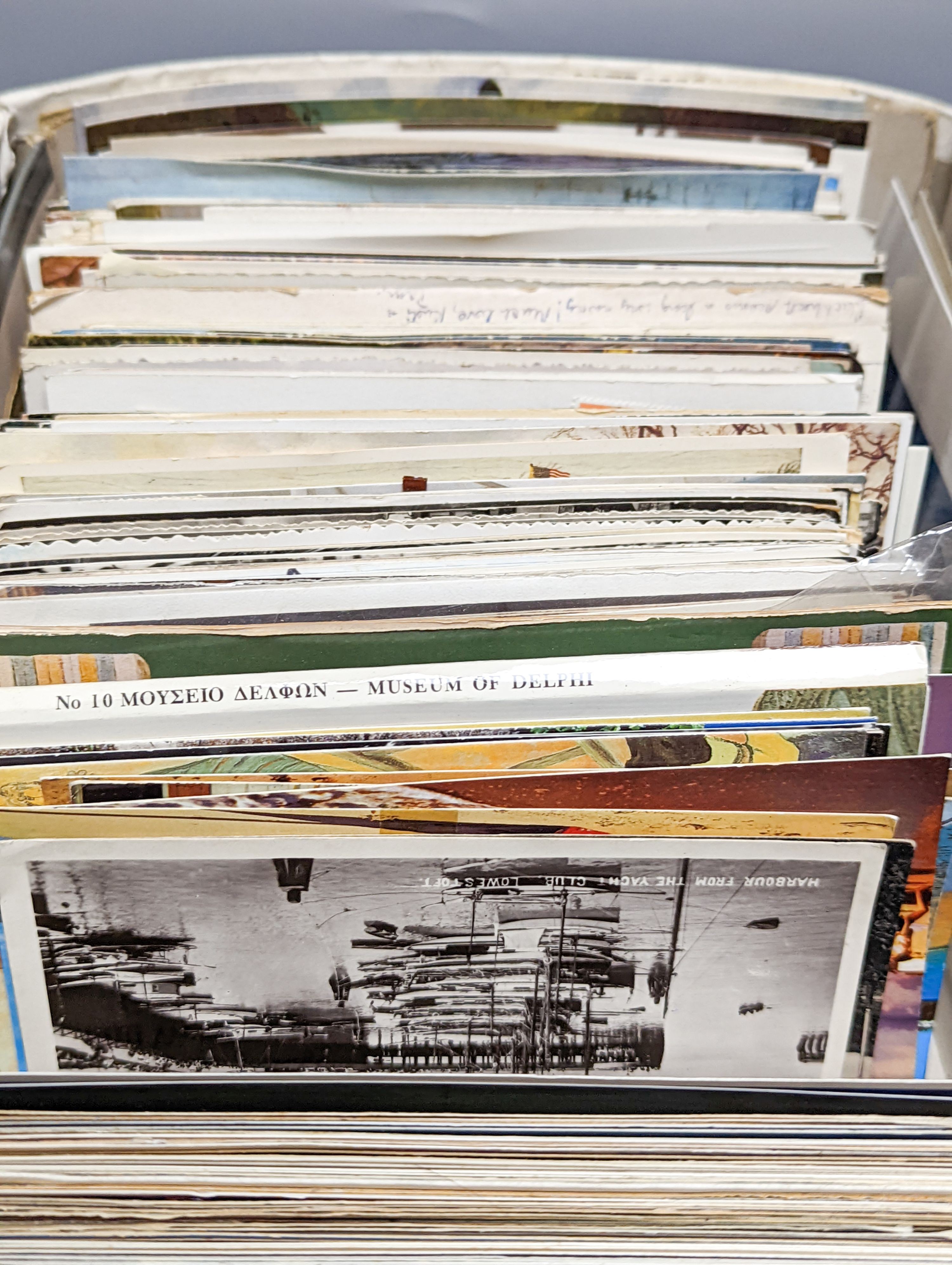 Two early 20th century postcard albums, a photo album and a collection of loose postcards